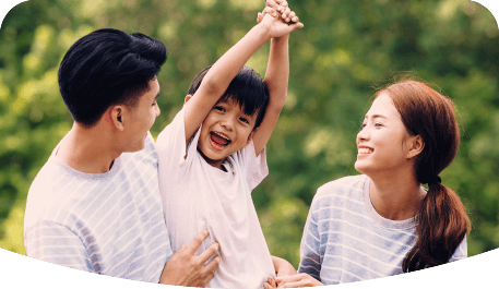 Smiling and laughing family enjoying their time in a park